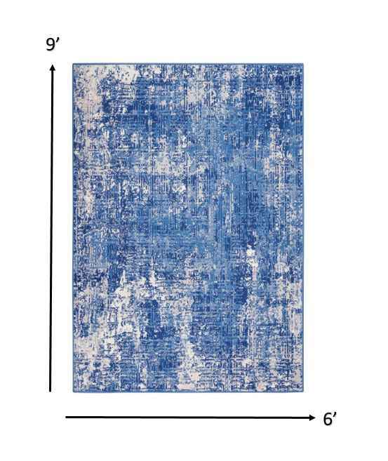 6' X 9' Blue And Ivory Abstract Dhurrie Area Rug