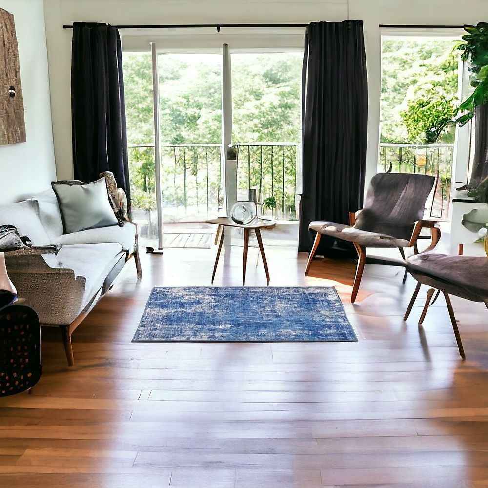 6' X 9' Blue And Ivory Abstract Dhurrie Area Rug