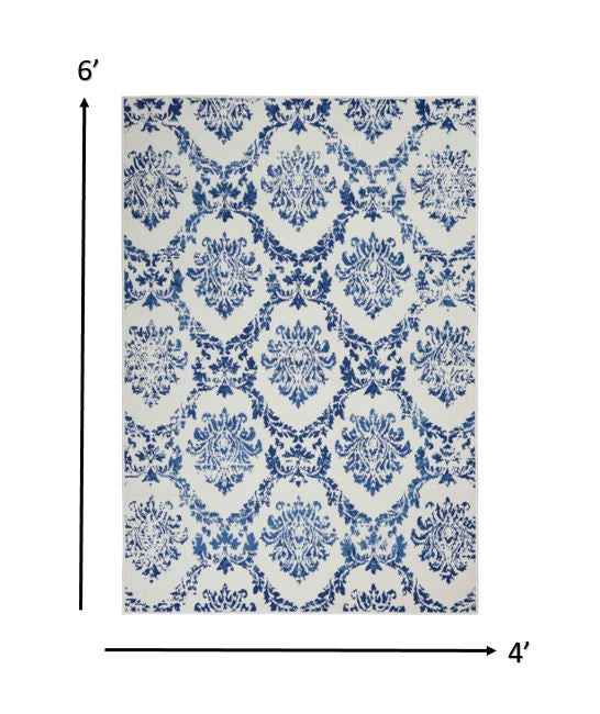 4' X 6' Blue And Ivory Floral Dhurrie Area Rug