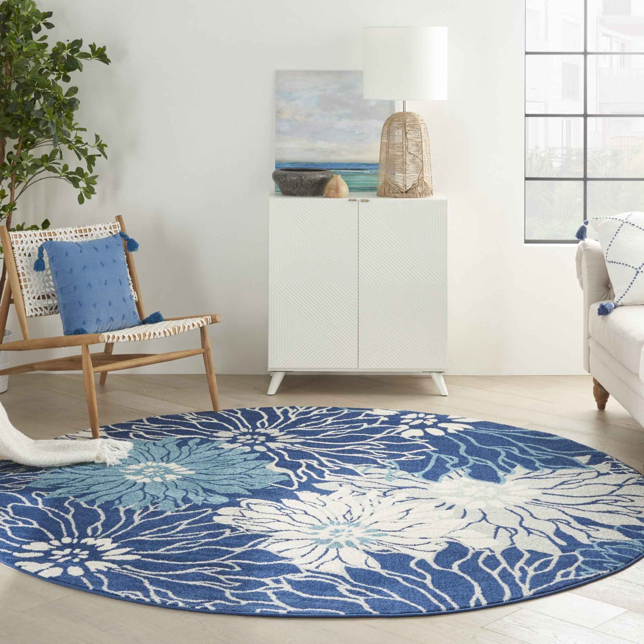 8' Blue And Ivory Round Floral Dhurrie Area Rug