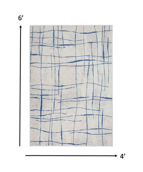 4' X 6' Blue And Ivory Abstract Dhurrie Area Rug