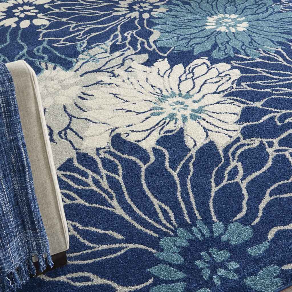 7' X 10' Blue And Ivory Floral Power Loom Area Rug