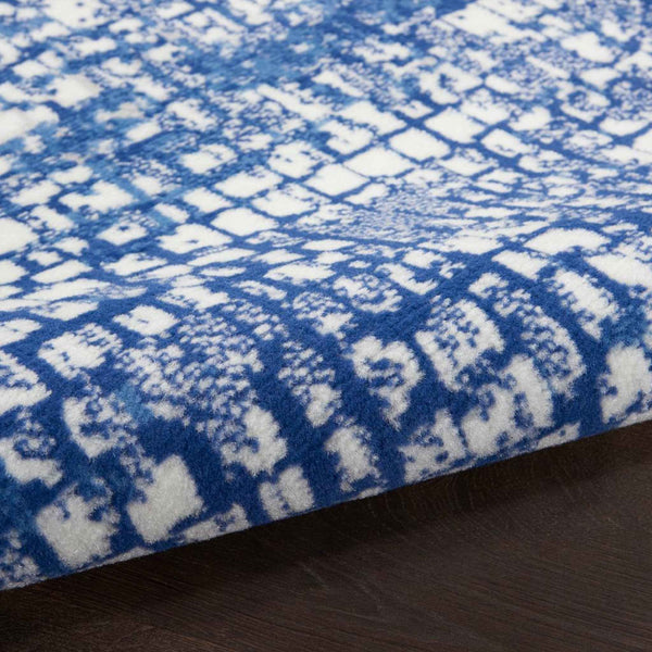 6' X 9' Blue And Ivory Abstract Dhurrie Area Rug