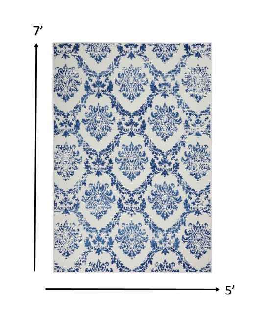 5' X 7' Blue And Ivory Floral Dhurrie Area Rug