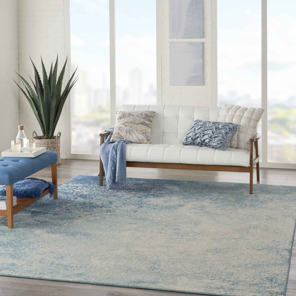 7' X 10' Ivory And Blue Abstract Power Loom Area Rug