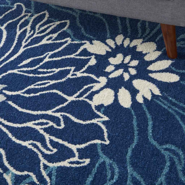 5' X 7' Blue And Ivory Floral Power Loom Area Rug