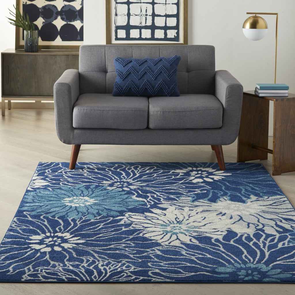 5' X 7' Blue And Ivory Floral Power Loom Area Rug