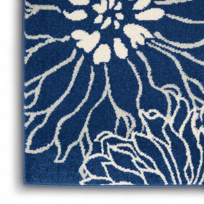 5' X 7' Blue And Ivory Floral Power Loom Area Rug