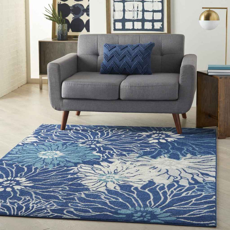 5' X 7' Blue And Ivory Floral Power Loom Area Rug