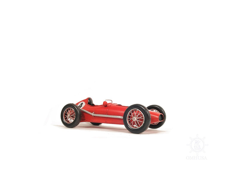 Red metal model car tabletop sculpture with spoked wheels, side profile view