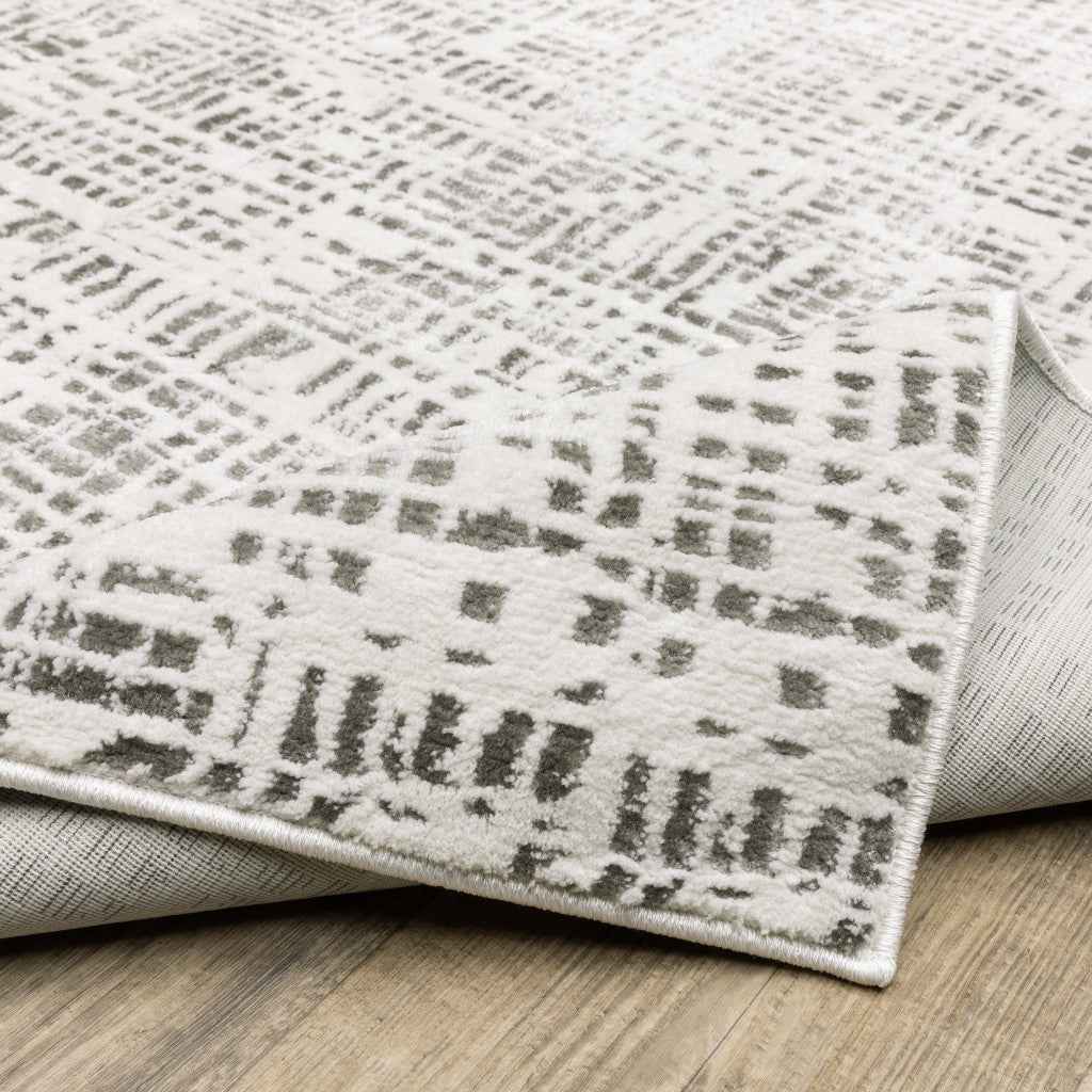 5' X 8' White And Grey Abstract Power Loom Stain Resistant Area Rug