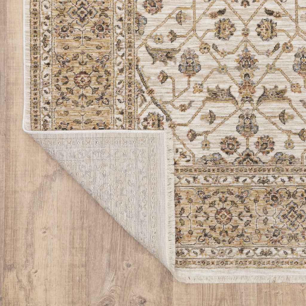 5' X 8' Ivory And Gold Oriental Power Loom Stain Resistant Area Rug With Fringe