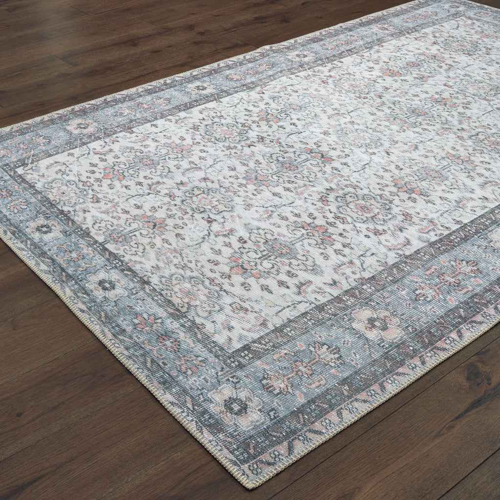 5' X 8' Ivory And Blue Oriental Power Loom Stain Resistant Area Rug