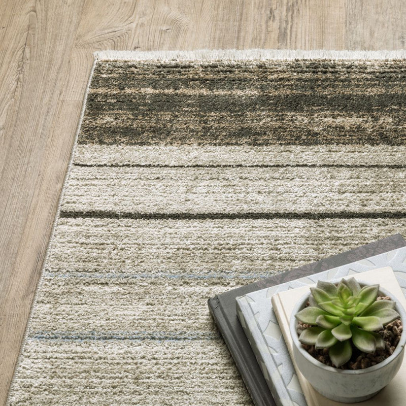 5' X 8' Beige Charcoal Brown Grey Tan Gold And Blue Geometric Power Loom Stain Resistant Area Rug With Fringe - Home & Garden