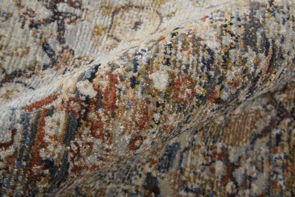 10' X 13' Tan Orange And Blue Floral Power Loom Distressed Area Rug With Fringe