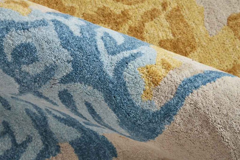 5' X 8' Ivory Yellow And Blue Wool Abstract Tufted Handmade Stain Resistant Area Rug