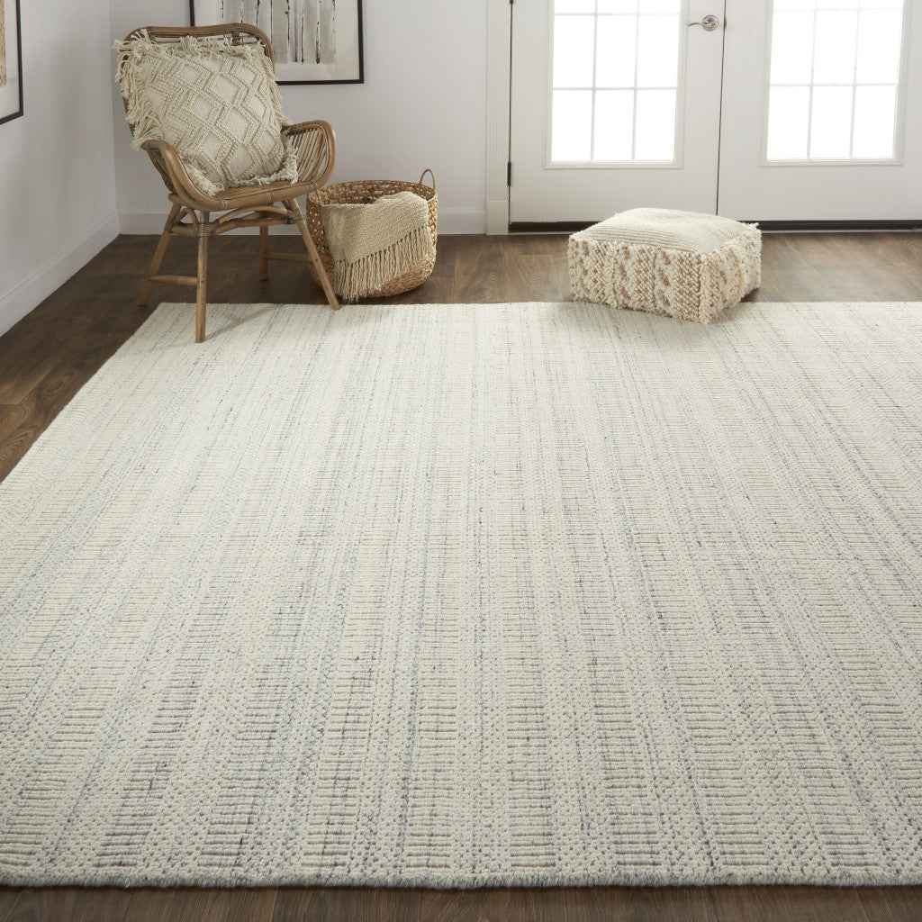 5' X 8' Ivory And Gray Wool Hand Woven Stain Resistant Area Rug