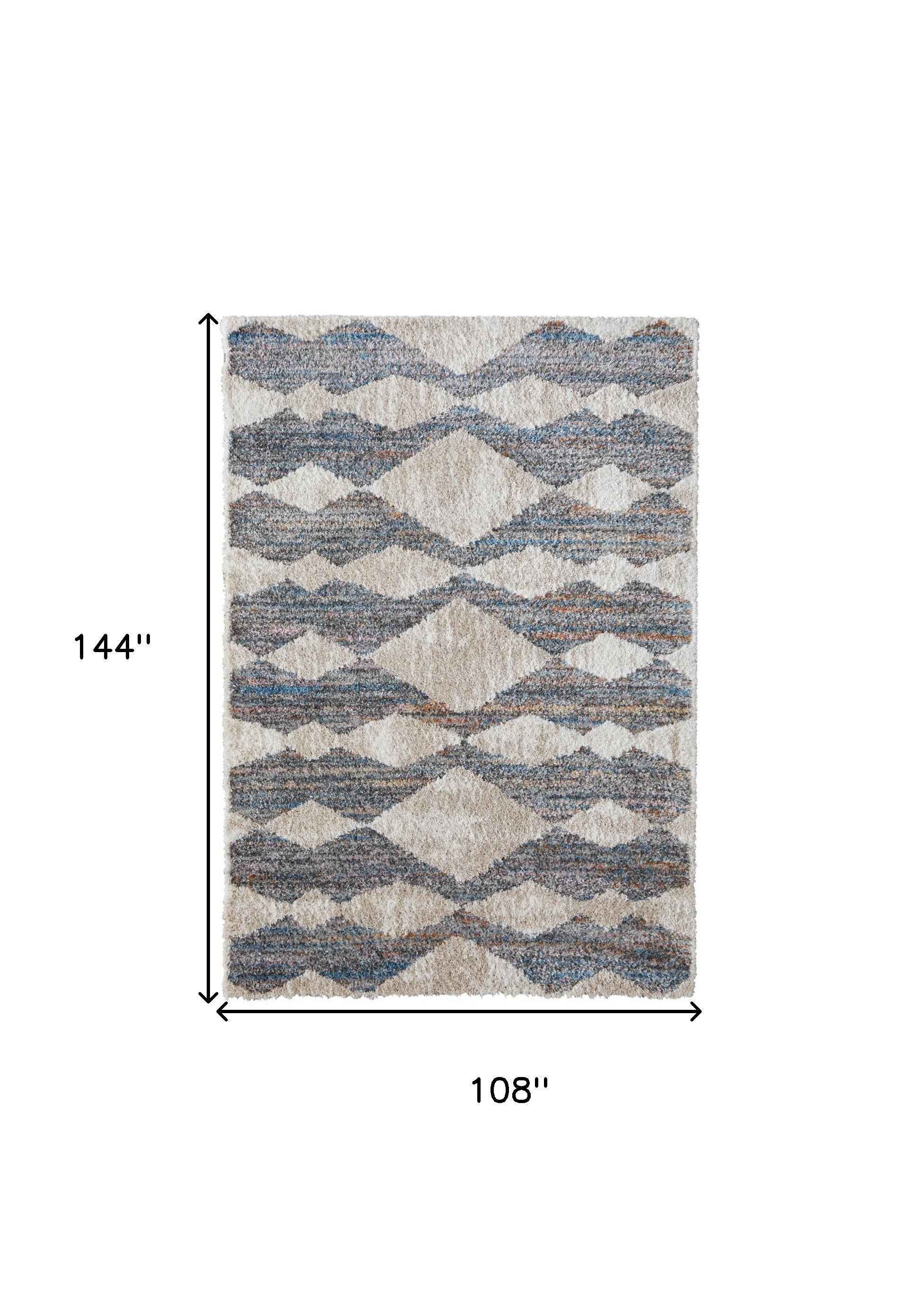 9' X 12' Tan Ivory And Blue Chevron Power Loom Stain Resistant Area Rug