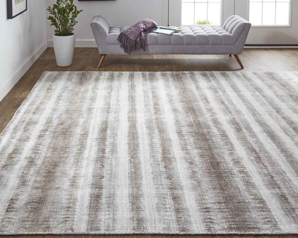 4' X 6' Tan Ivory And Brown Abstract Hand Woven Area Rug