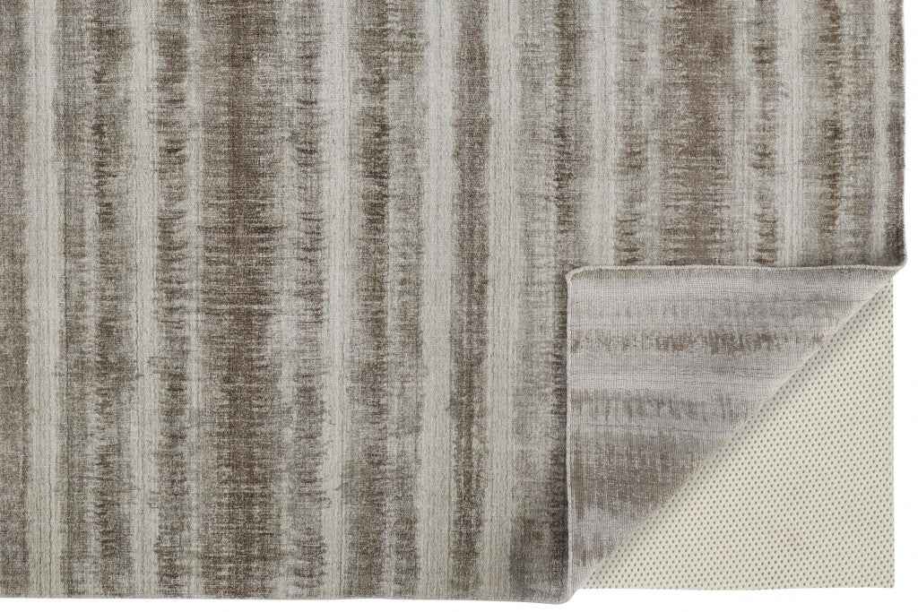 4' X 6' Tan Ivory And Brown Abstract Hand Woven Area Rug