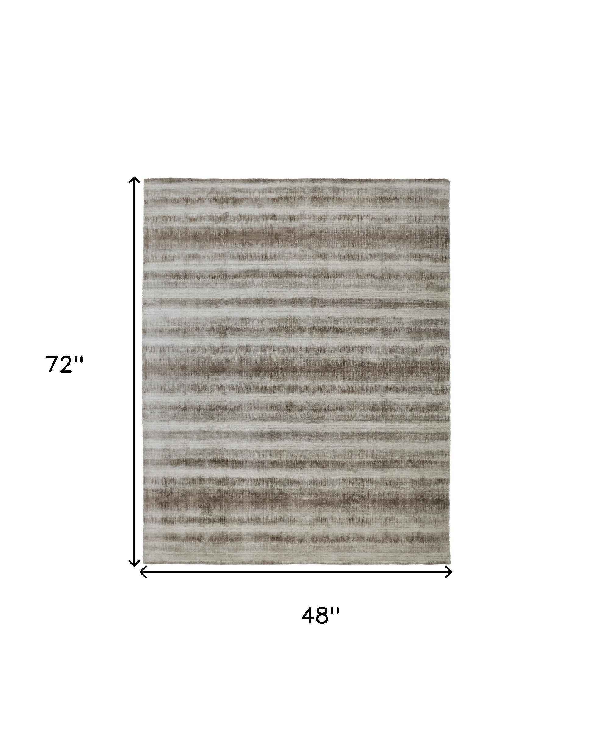 4' X 6' Tan Ivory And Brown Abstract Hand Woven Area Rug