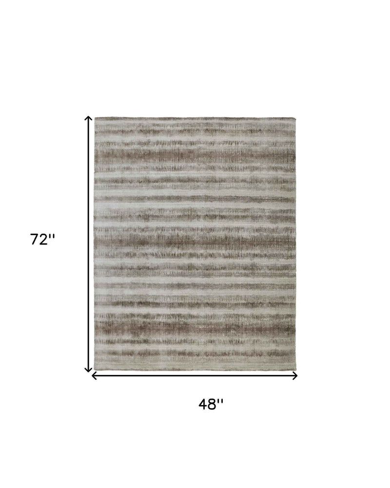 4' X 6' Tan Ivory And Brown Abstract Hand Woven Area Rug