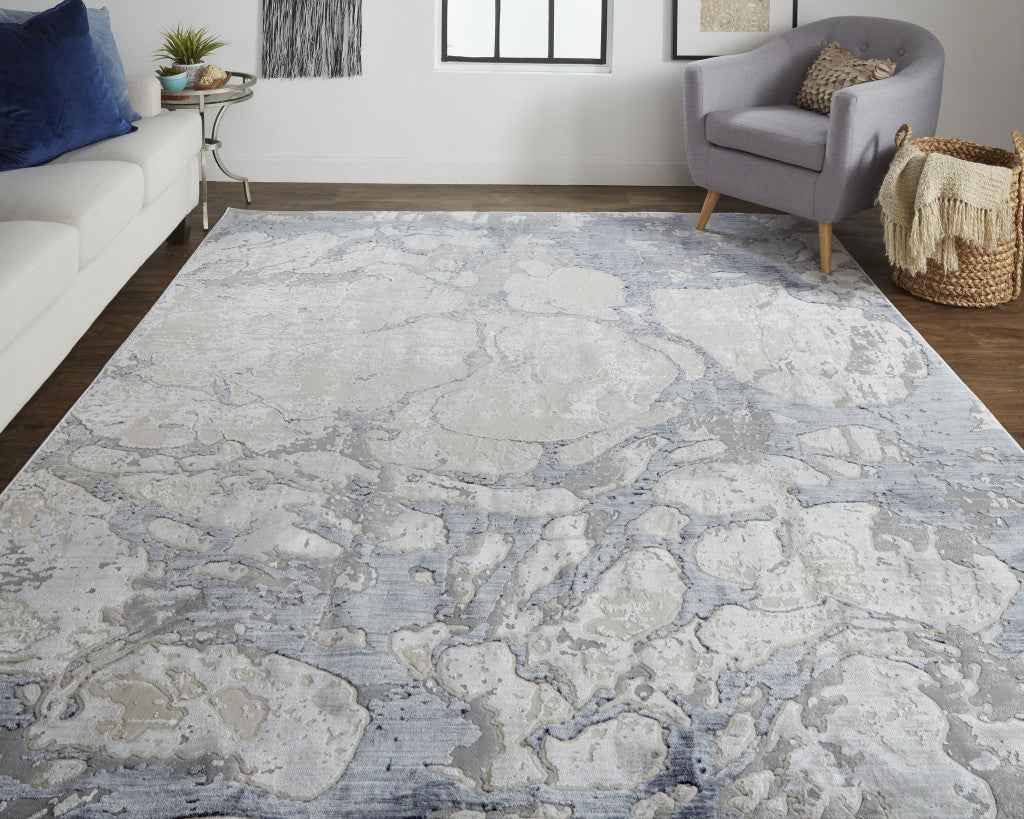 5' X 8' Ivory And Blue Abstract Power Loom Distressed Area Rug