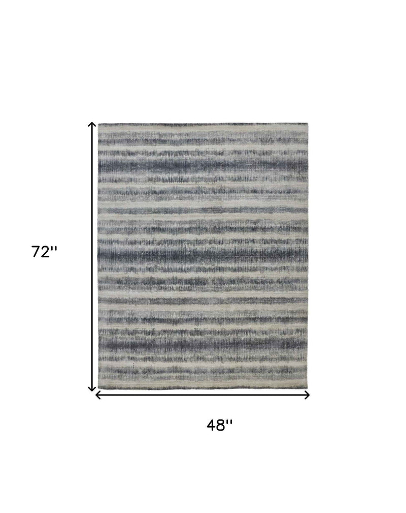 4' X 6' Ivory And Blue Abstract Hand Woven Area Rug