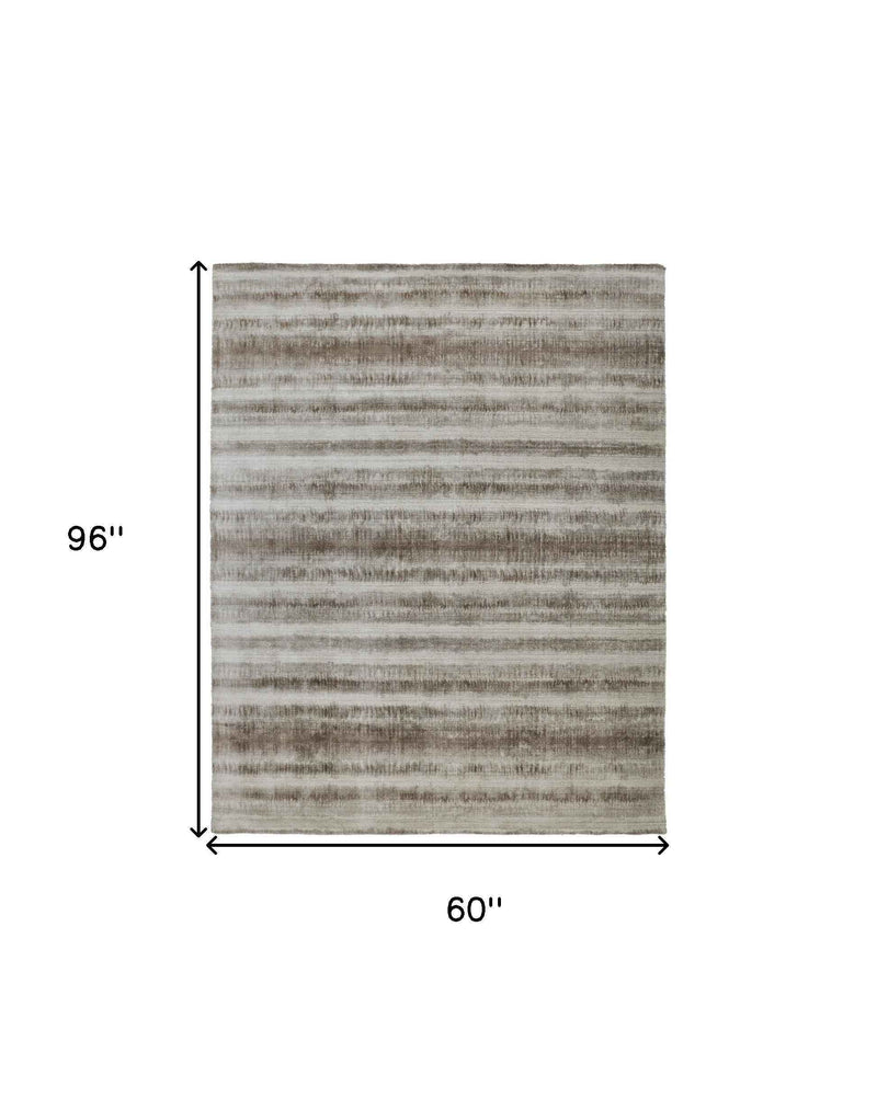 5' X 8' Tan Ivory And Brown Abstract Hand Woven Area Rug