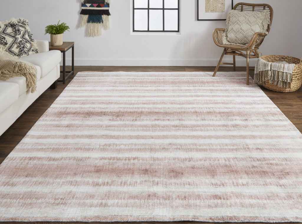 5' X 8' Tan Ivory And Pink Abstract Hand Woven Area Rug
