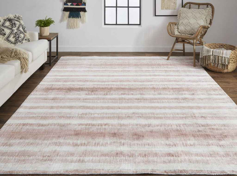 5' X 8' Tan Ivory And Pink Abstract Hand Woven Area Rug