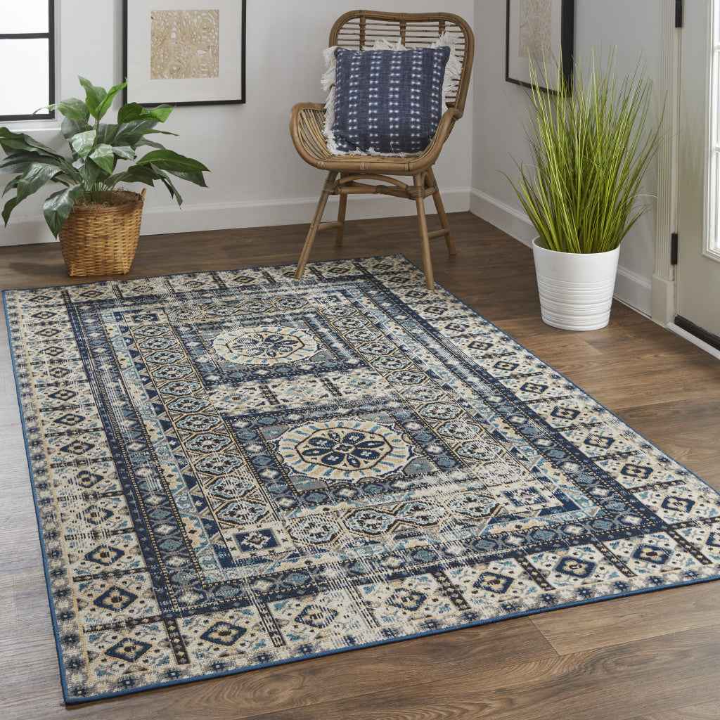 7' X 10' Ivory Tan And Blue Abstract Power Loom Distressed Stain Resistant Area Rug