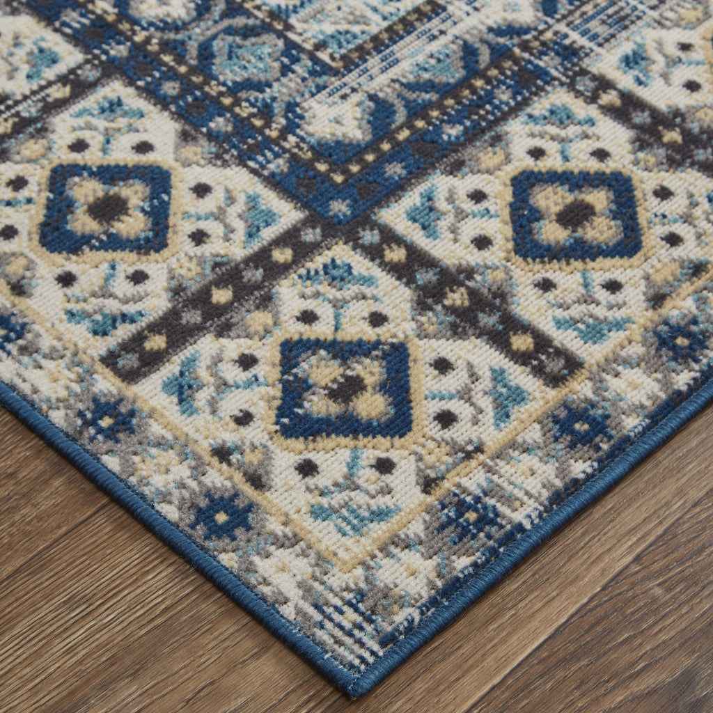 7' X 10' Ivory Tan And Blue Abstract Power Loom Distressed Stain Resistant Area Rug