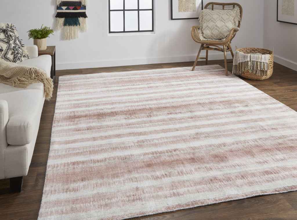 2' X 3' Tan Ivory And Pink Abstract Hand Woven Area Rug