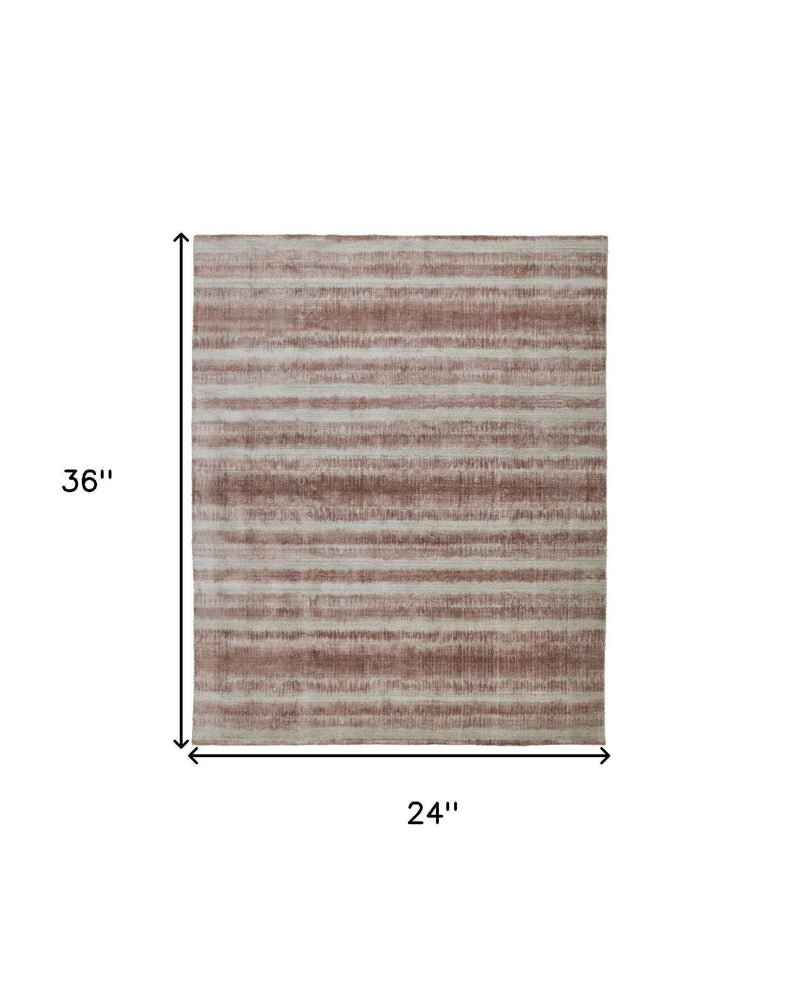 2' X 3' Tan Ivory And Pink Abstract Hand Woven Area Rug