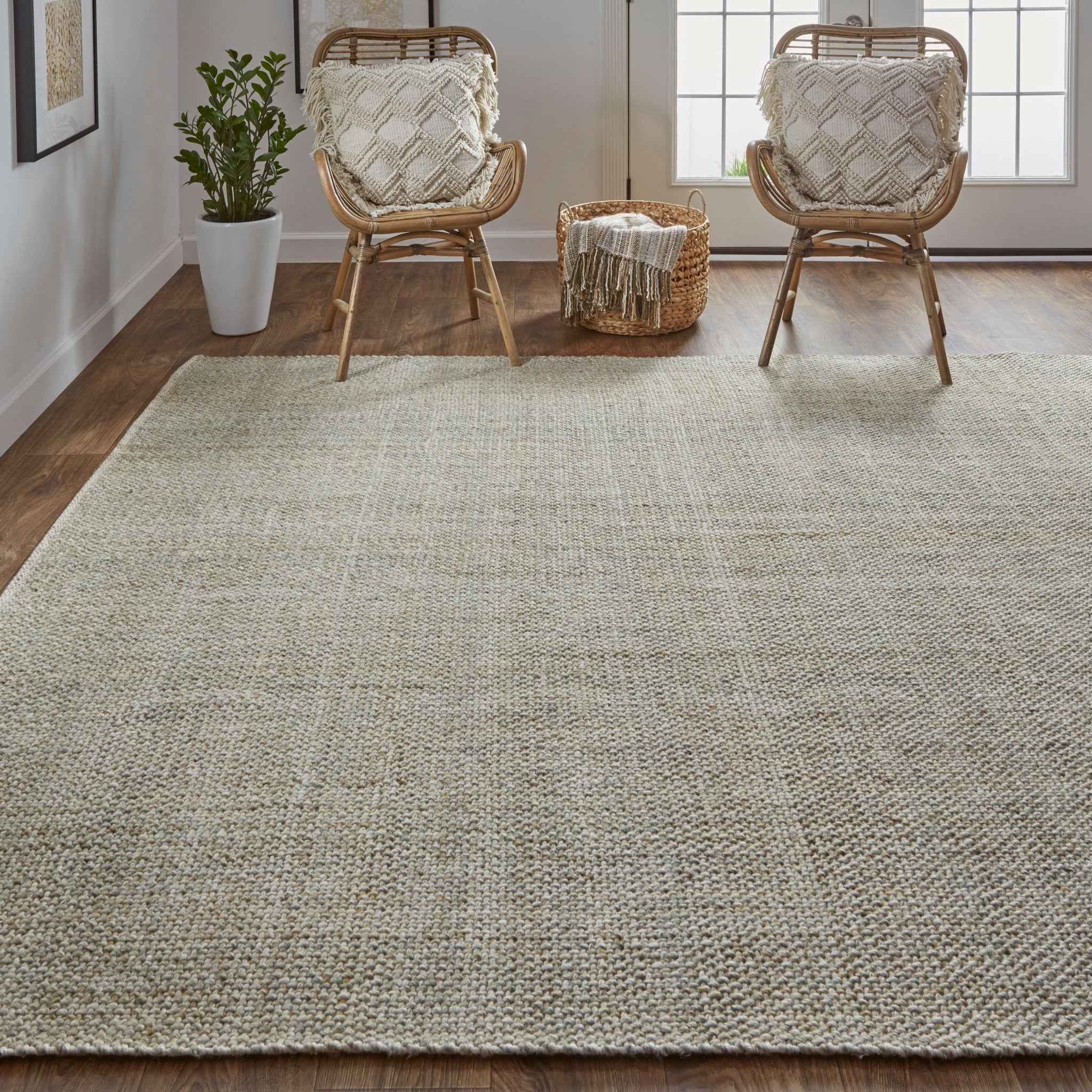 5' X 8' Green And Tan Hand Woven Area Rug