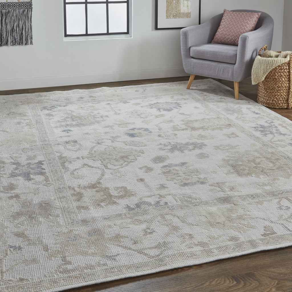 5' X 8' Tan Ivory And Orange Floral Hand Knotted Stain Resistant Area Rug