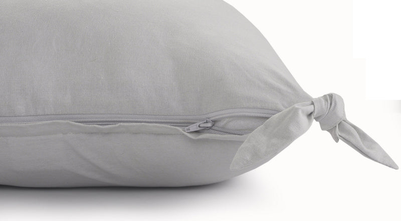 Light gray zippered cotton pillow cover with zipper track and corner tie