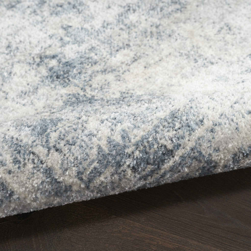 9' x 12' Blue and Ivory Oriental Power Loom Distressed Area Rug