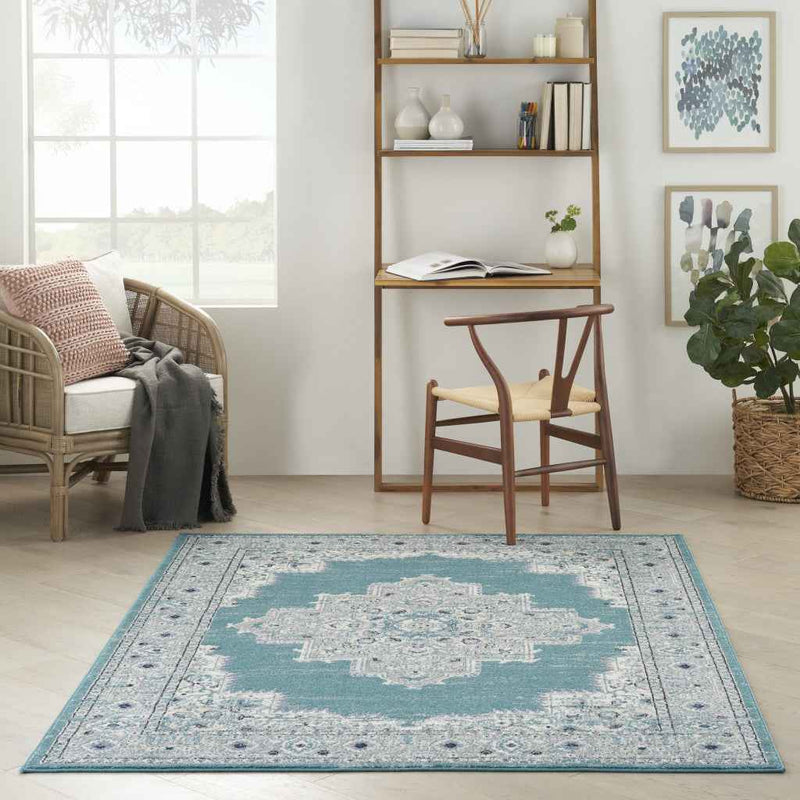 5' x 7' Aqua Floral Power Loom Distressed Area Rug