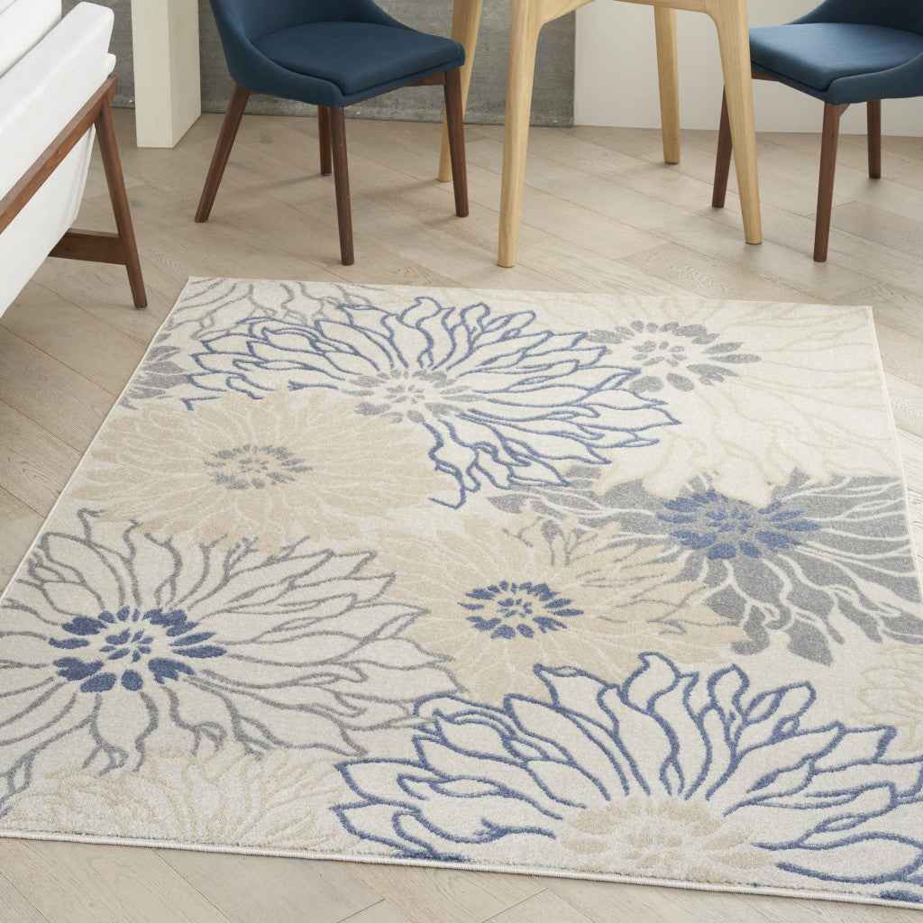 5' x 7' Cream Floral Power Loom Distressed Area Rug