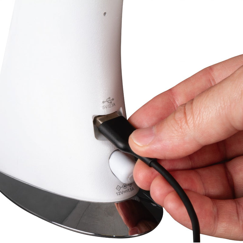 White sanitizing LED lamp base with power cord plugged in by hand
