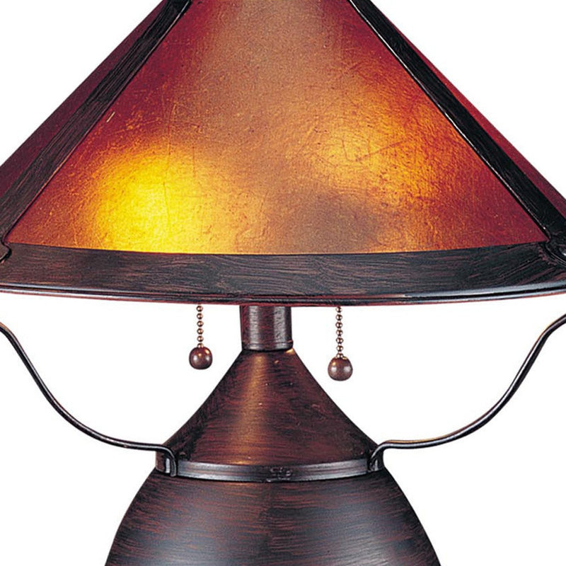 Amber empire lamp shade with dark metal trim, two hanging pulls, and arched frame