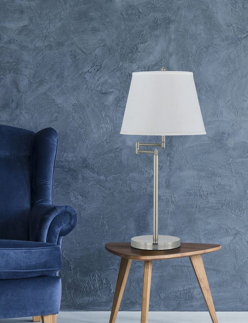 Nickel table lamp with off-white empire shade on slim metal stand and round base