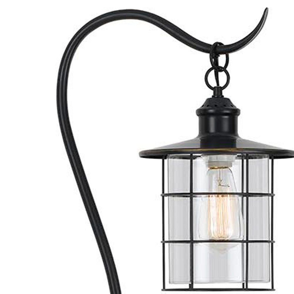 Black industrial-style hanging lantern with a clear glass shade and vintage Edison bulb.