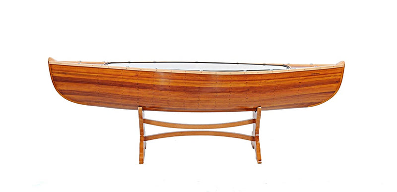 Canoe-shaped wood coffee table with clear glass insert