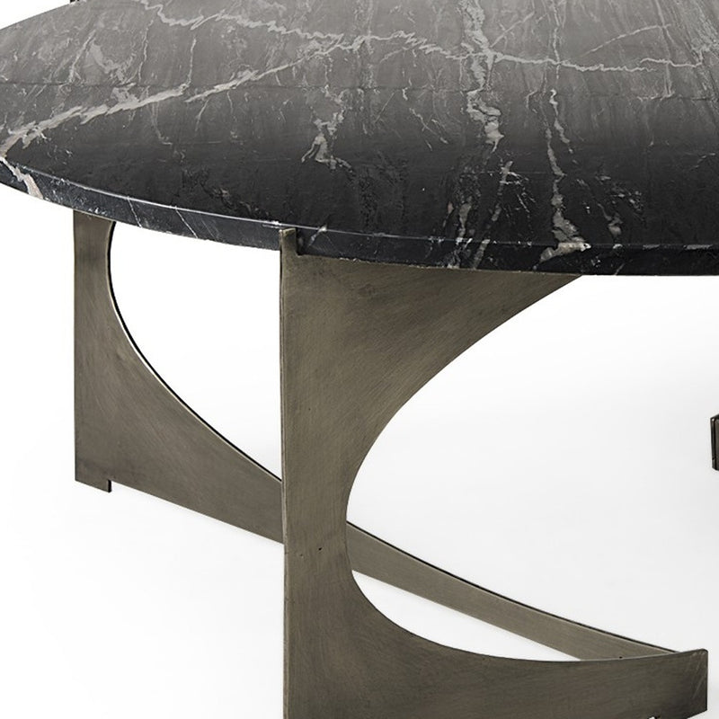 Black marble coffee table edge with white veining and dark metal corner support