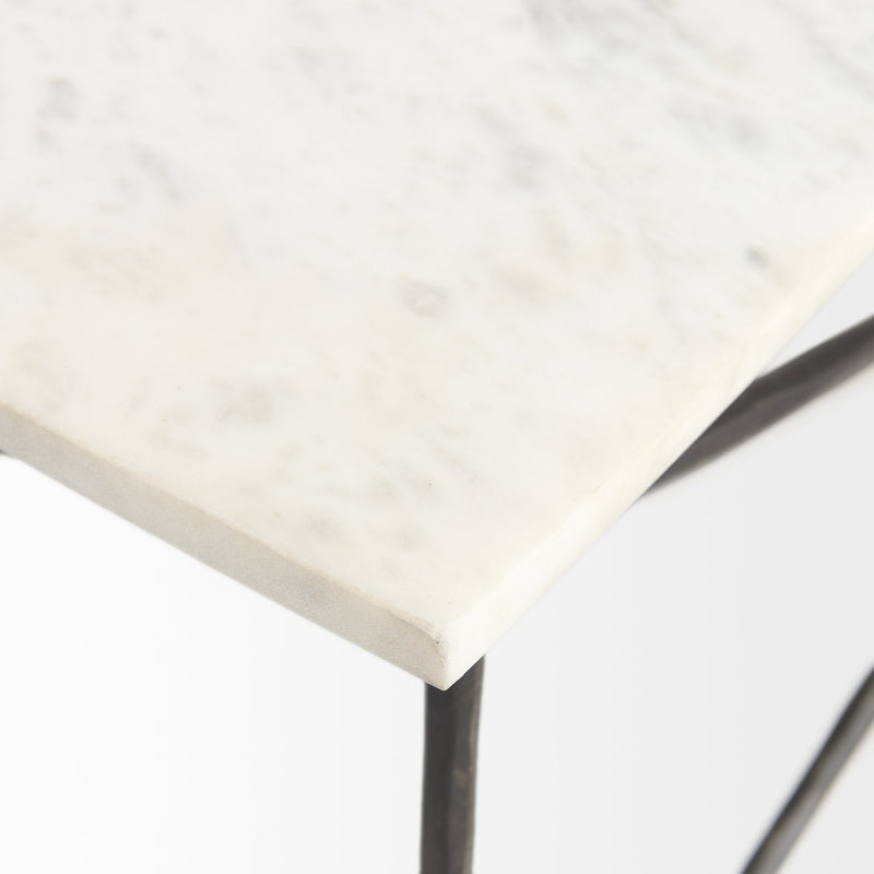 White marble table edge with black metal support leg