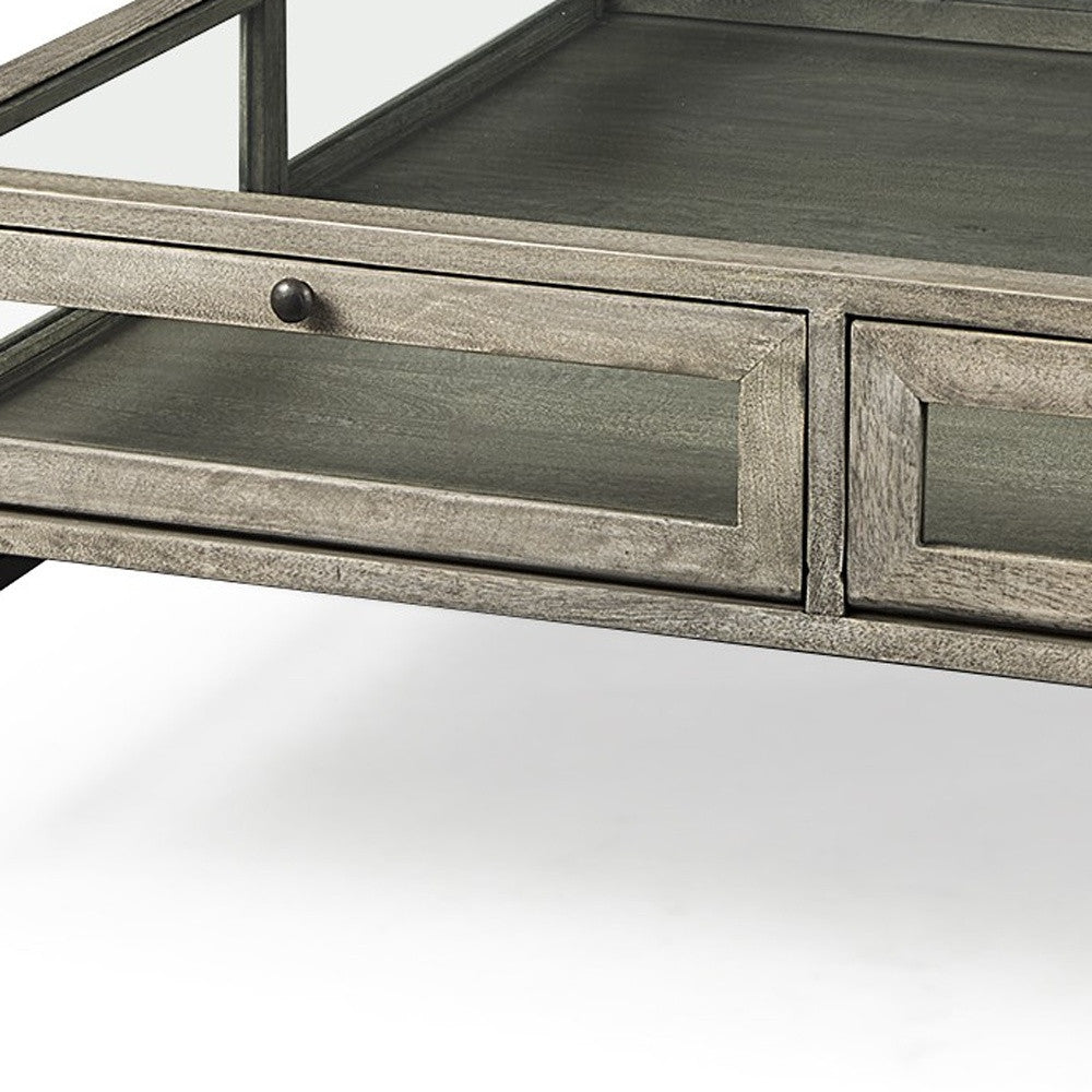 Square coffee table drawer front detail with gray wood-look finish and round black knobs