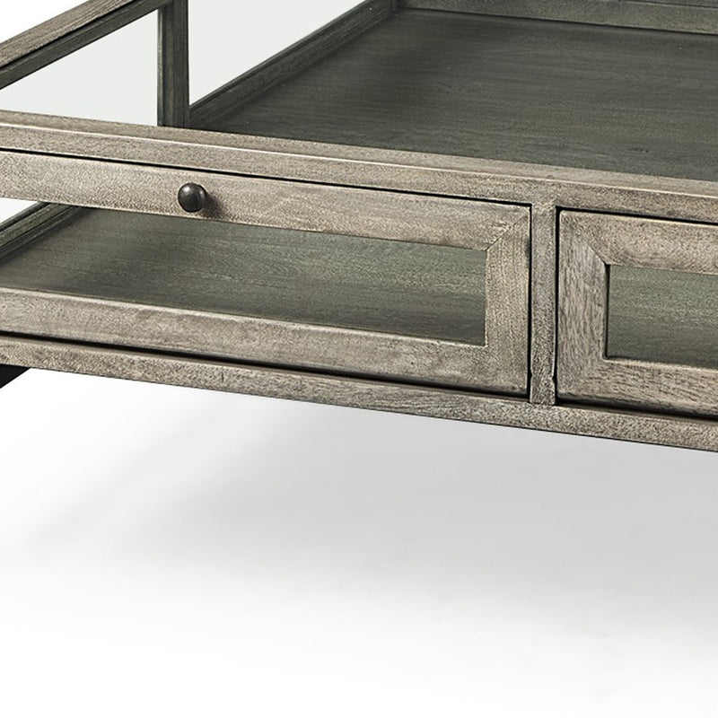 Square coffee table drawer front detail with gray wood-look finish and round black knobs